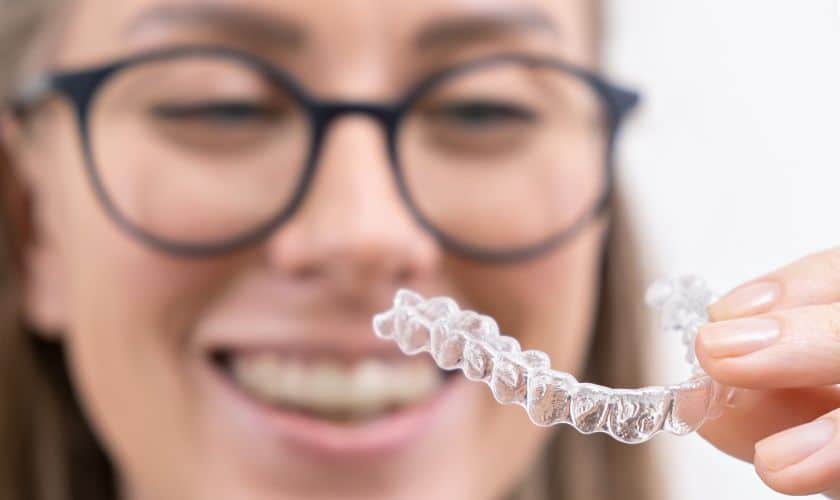 Mastering Oral Hygiene: A Guide to Brushing Your Teeth with Invisalign Aligners - Woolaver Orthodontics