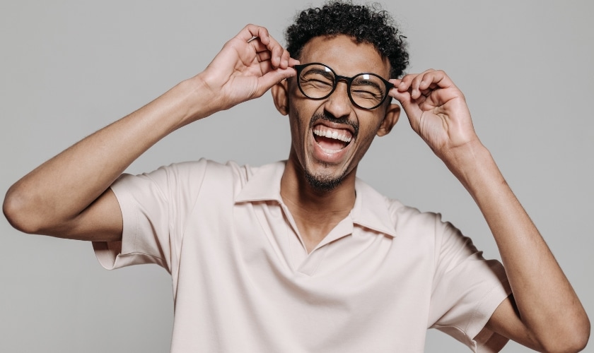 An image showing a person smiling confidently, highlighting the transformation and confidence boost braces can provide.