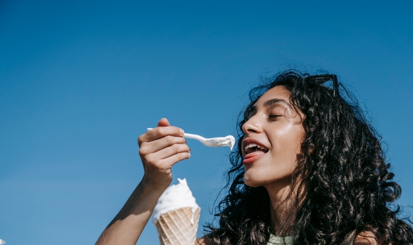 A girl eating ice cream.