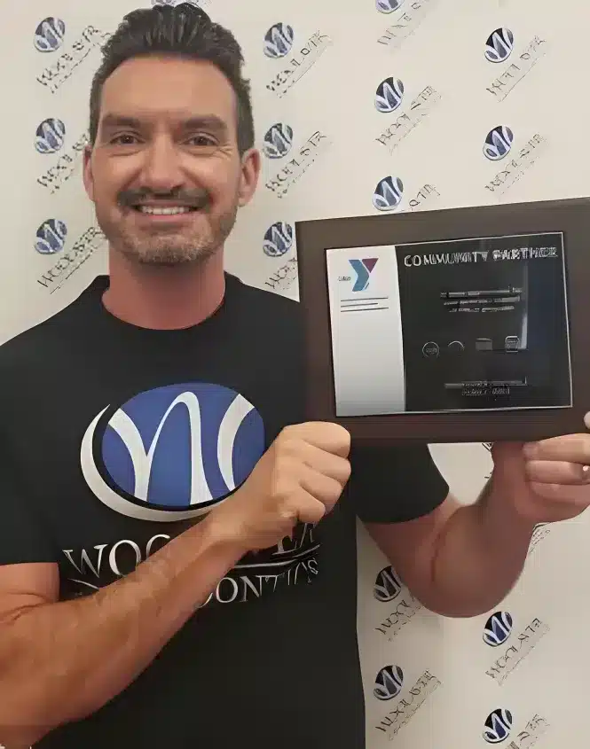 Dr Chris Woolaver flashing a certificate