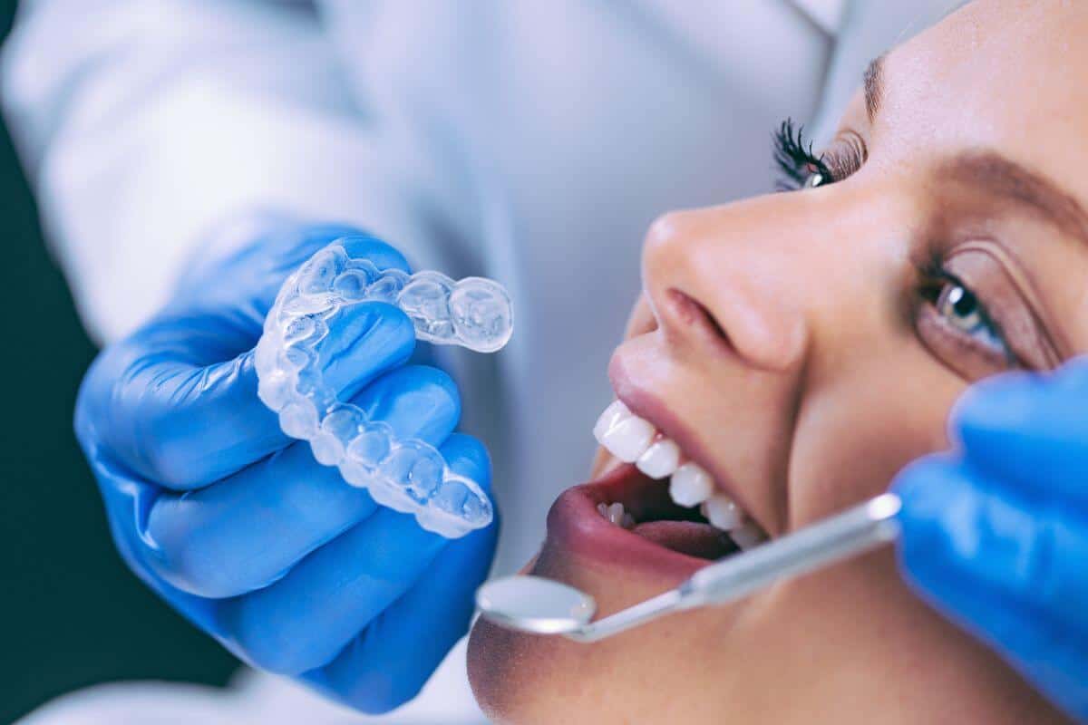 close up of woman getting invisalign