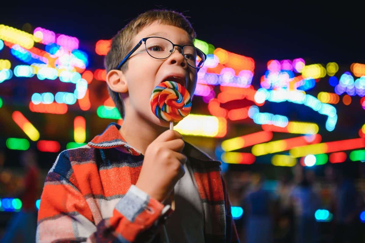 kid with braces eating candy during christmas